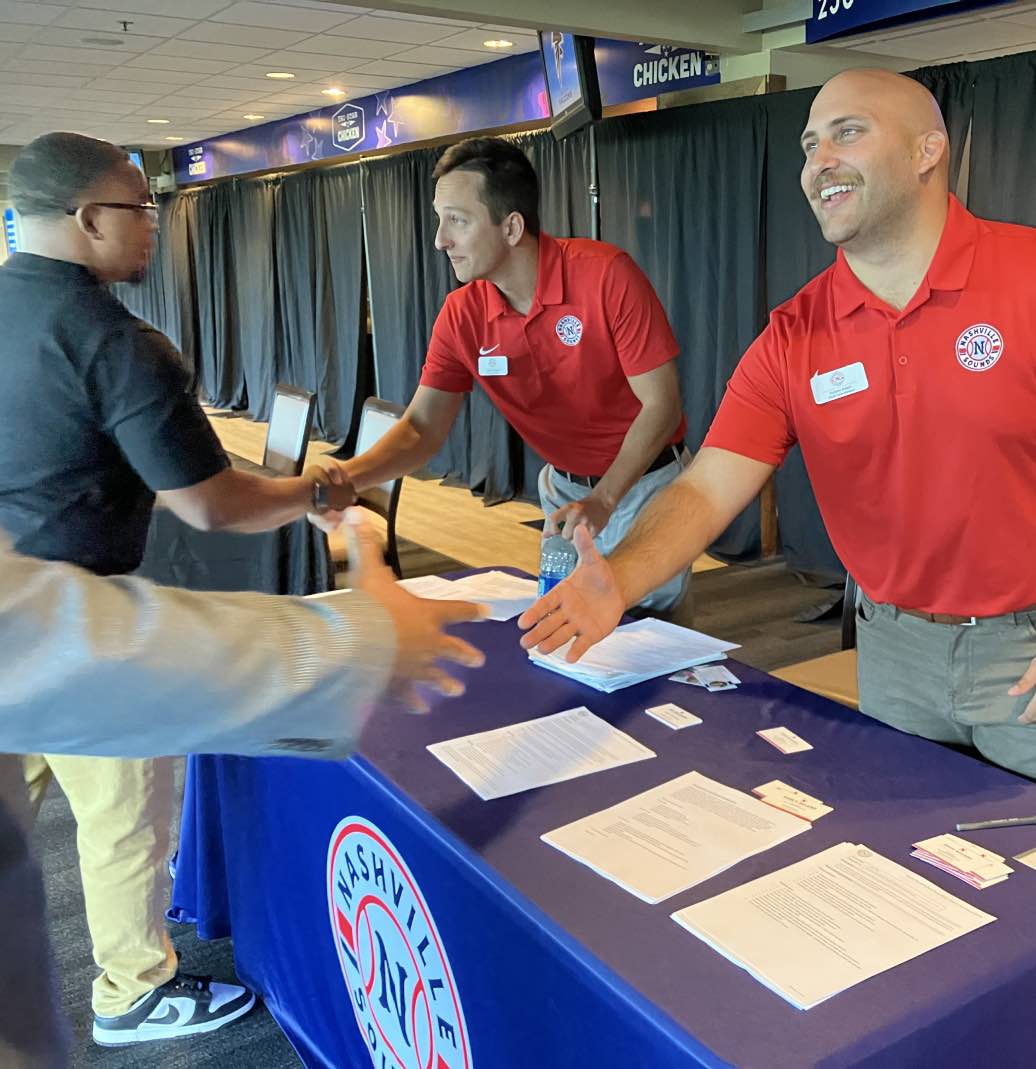 Candidates meeting potential employers at a career fair